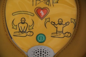 close up of on/off button on Heartsine public access defibrillator